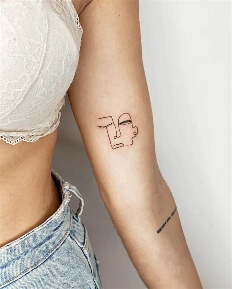 Fine line tattoos .
